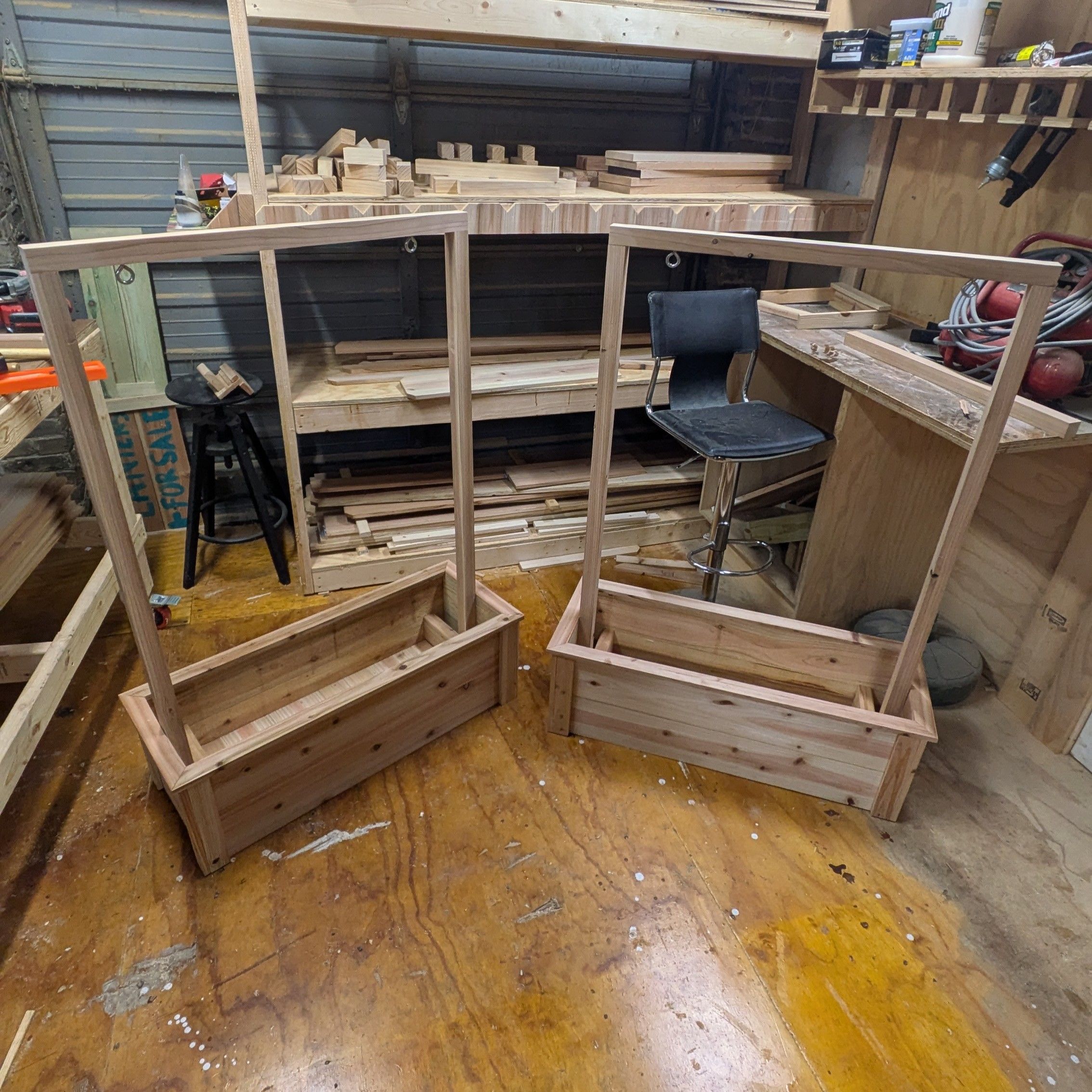 Planters on wheels with hooks to hang business signs